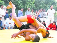 A wrestling match in progress between the players of Jhajjar and Bhiwani on the concluding day of the 27th State-Level Primary School Games, held at Tau Dev Lal Stadium, Sector 3, Panchkula, on Thursday