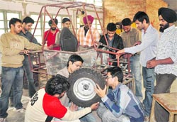 PEC students work on their dream machine Torero at the college workshop in Chandigarh on Thursday