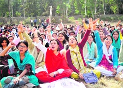 BTC trainees stage a dharna at the Parade Ground in Dehradun on Thursday
