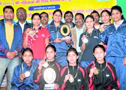The winners of the state-level badminton and table tennis tournaments for women organised by the Youth Welfare Department in Dehradun on Thursday