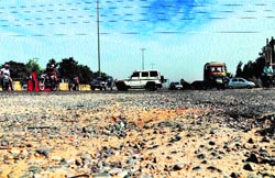 Vehicles ply on the damaged national highway near Sector 37 in Gurgaon