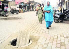 An uncovered sewerage manhole at College Road in Jagraon