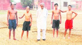 Bikar Singh with young kabaddi players at Mandi Ahmedgarh