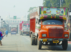 Trucks cross over from Pakistan to the Indian side at the Attari-Wagah border in Amritsar.