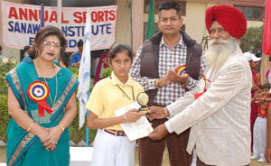 A students receiving award during the annual sports meet organised by the Sanawar School, Bathinda on Thursday. 