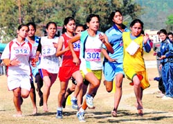 Students take part in the Inter-college Athletics Meet of HNB Garhwal University at Maharana Pratap Sports College in Dehradun on Friday