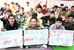 Activists of the ABVP protest against the new recruitment policy of the state government in Jammu on Friday