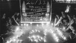 Members of the Indian Army Fans Club light candles to pay homage to the victims of 26/11 Mumbai terrorist attack, at Sector 17 in Chandigarh on Saturday.