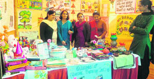 Education department staff display items, prepared by children, during the Chandigarh Carnival at the Leisure Valley in Sector 10 of Chandigarh. 