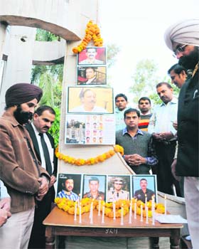 Members of the National Integrated Forum of Artists and Activists pay tributes to the victims of the 26/11 Mumbai attacks in Karnal on Saturday