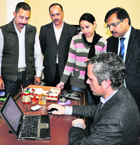 Chief Minister Omar Abdullah puts Jammu and Kashmir Construction Corporation on an e-tendering portal in Jammu on Saturday.