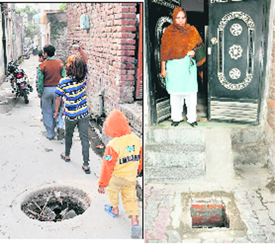 Unaware of the risk involved, children pass by an open manhole at Upkar Nagar; and (right) a woman shows an open manhole at Lamma Pind outside her house in Jalandhar