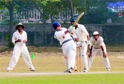 A batsman plays a shot during a cricket match in Ludhiana on Saturday