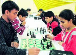 Players concentrate on their moves during a match of the chess tournament in Ludhiana on Saturday