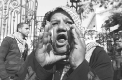 A protester shouts in front of the headquarters of the Egyptian cabinet in Cairo