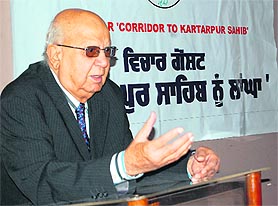Dr Taj Kirmani, an eye surgeon from Pakistan, addresses a seminar on Corridor to Kartarpur Sahib at Sant Singh Sukha Singh School in Amritsar on Sunday. Photo: Sameer Sehgal
