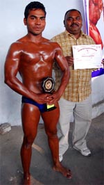 Rajan, along with his father, during the Body Building Competition organised in Bathinda on Sunday