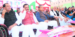 Senior state Congress leaders at a rally in Pithoragarh on Sunday. 