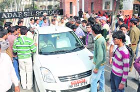 Candidates who were not allowed to appear in the test for the clerical cadre held by the Institute of Personal Banking Selection gherao bank officials in Karnal on Sunday