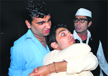 Artistes enact a scene from Hindi play Topian which was staged at Natrang Studio Theatre in Jammu on Sunday.
