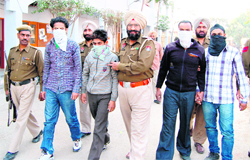 Four members of a gang of robbers in police custody in Amritsar on Monday.