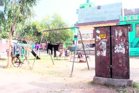 A public park is a picture of neglect as residents have put up lines to dry clothes in old Indira Colony