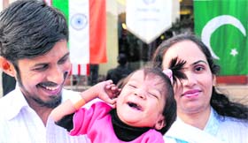 Mahira (2), a Pakistani girl, with her parents after her successful heart surgery in Chandigarh on Monday