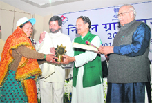 Chief Minister BC Khanduri gives away the Nirmal Gram Award at a function in Dehradun on Monday. 