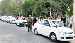 Security forces stage a flag march in Adampur Assembly segment 