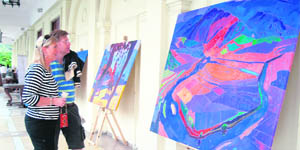 Visitors have a look at the creations of Myanmar artist Zaw Win Pe at DLF Golf and Country Club in Gurgaon