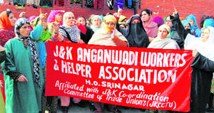 Anganwari workers hold a protest in support of their demands in Srinagar on Monday.