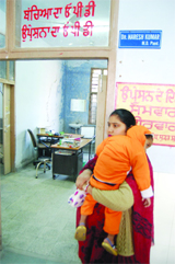 A visitor to the Civil Hospital waits for the doctors to resume work.