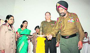 Lieut-Gen Baljeet Singh, Chief of Staff, Headquarters Western Command, lights the ceremonial lamp on the initiation of probationers in the profession of nursing at Command Hospital, Chandi Mandir, on Tuesday.