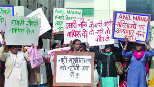 Workers of Anil Nandas company, Mohan Co-oprative Estate, hold a protest at Okhla against the alleged injustice and the conspiracy hatched against them by the company, in New Delhi on Tuesday