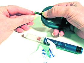 A sugar patient giving a blood sample for a test