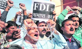 Activists of the Dogra Front and the Shiv Sena protest against the FDI in the retail sector in Jammu on Tuesday