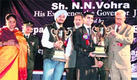 Governor NN Vohra presents the Silver Rolling Trophy to winners of the second annual inter-state (northern zone) declamation contest in Jammu