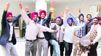 The bhangra team of Guru Nanak Institute of Management and Technology are all smiles as they pose for a picture in Ludhiana.