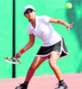 A player in action in a match in the All-India Talent Series Tennis Tournament in Dehradun 