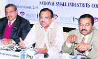 Rakesh Sharma (centre), Principal Secretary, Industries, addresses industrialists at a meeting in Dehradun