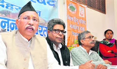 Dinesh (left), general secretary (organisation) of the VHP, addresses mediapersons in Dehradun 