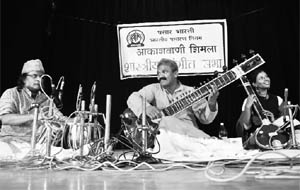 Rajiv Kumar Janardan from New Delhi plays the sitar at a classical music programme at Kalibari in Shimla on Wednesday. 
