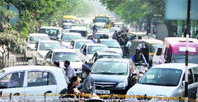 Commuters have a tough time as representatives of the Ministerial Staff Union and the PCCTU stage a dharna at Namdev Chowk in Jalandhar on Wednesday