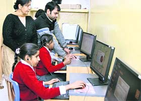 Computer teacher Deepak Arora at the Red Cross School for the Deaf along with Principal Harwinder Kaur