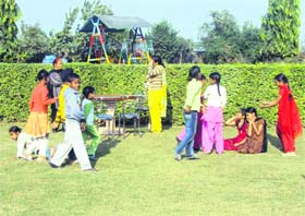 Children play at a park in the orphanage at Talwandi Khurd village near Jagraon