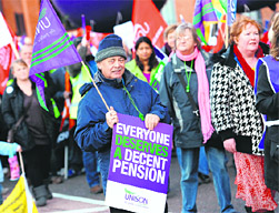 Demonstrators march with banners as they hold a protest in Birmingham on Wednesday.  AFP