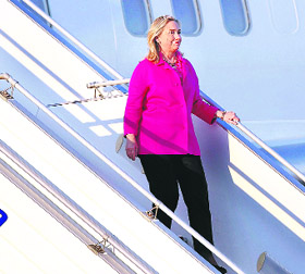 US Secretary of state Hillary Clinton steps out of her plane after landing in Naypyitaw on Wednesday.  Reuters