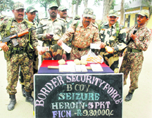 BSF jawans with the seized contraband in Amritsar on Thursday.