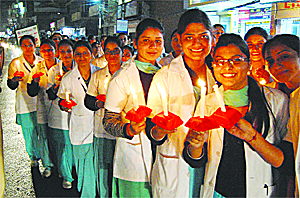 Students from various nursing colleges participate in an AIDS awareness candlelight march on the occasion of World AIDS Day in Amritsar on Thursday. 