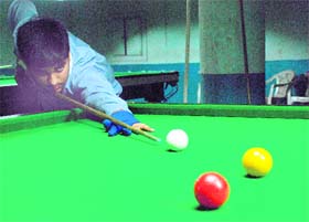 Saransh Chaudhary aims a shot during the Sub-Junior Billiards Championship at Sector 11, Panchkula, on Thursday